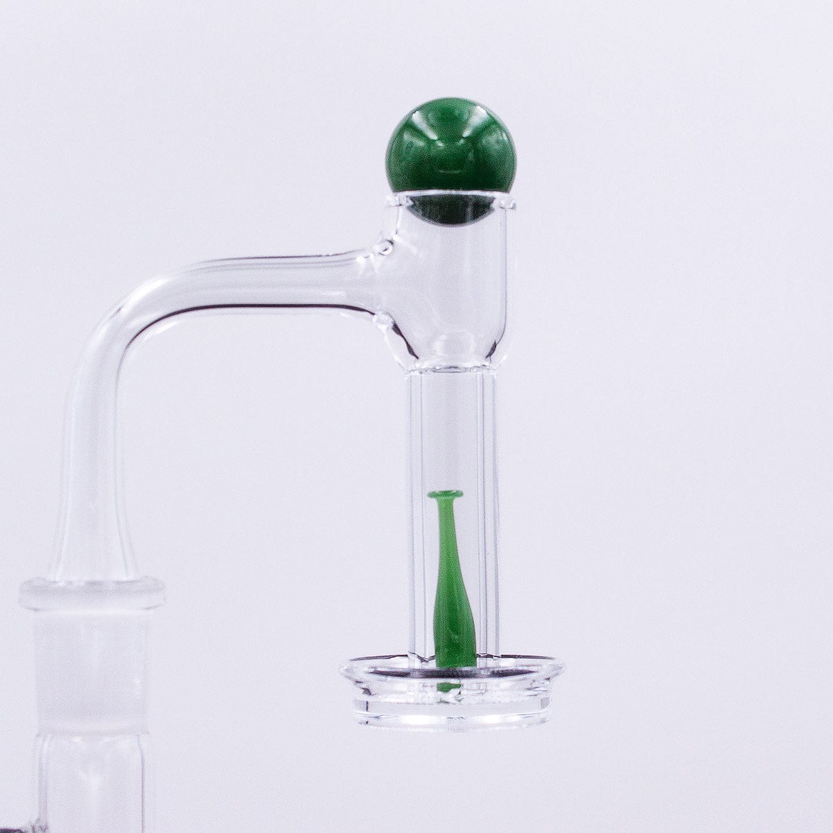 A close-up, angled view of the Baseball Bat Terp Slurper Set, showcasing its clear glass construction and unique curved design.