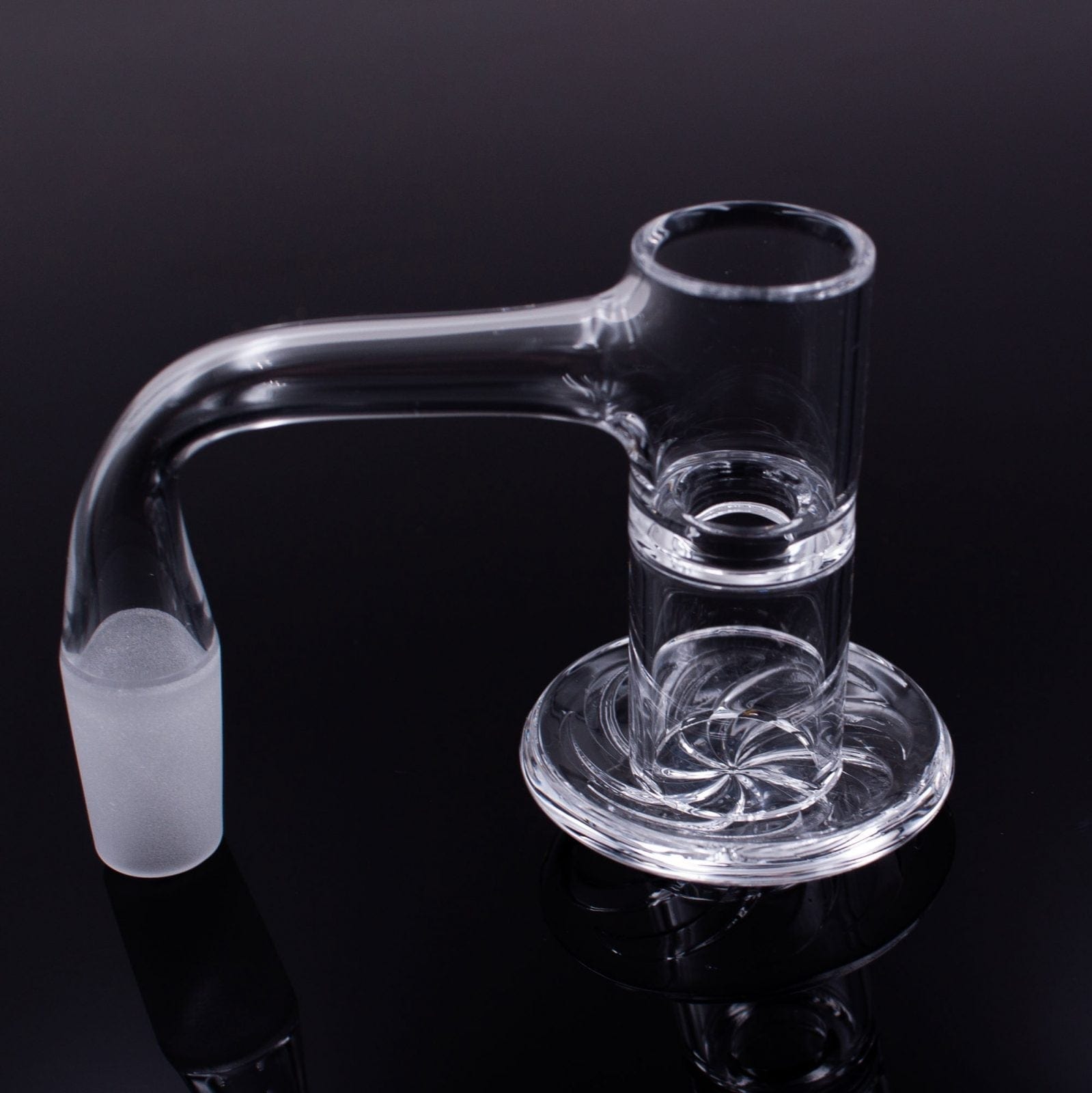 A close-up, angled view of the Full Weld Straight Blender Slurper Quartz Banger, displaying its clear glass construction and rounded shape.