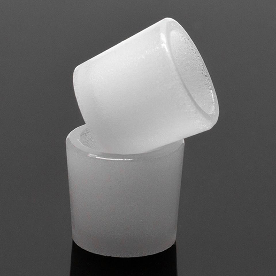 A close-up, angled view of the Puffco Peak Gavel Bowl, showing its ceramic construction against a dark background.