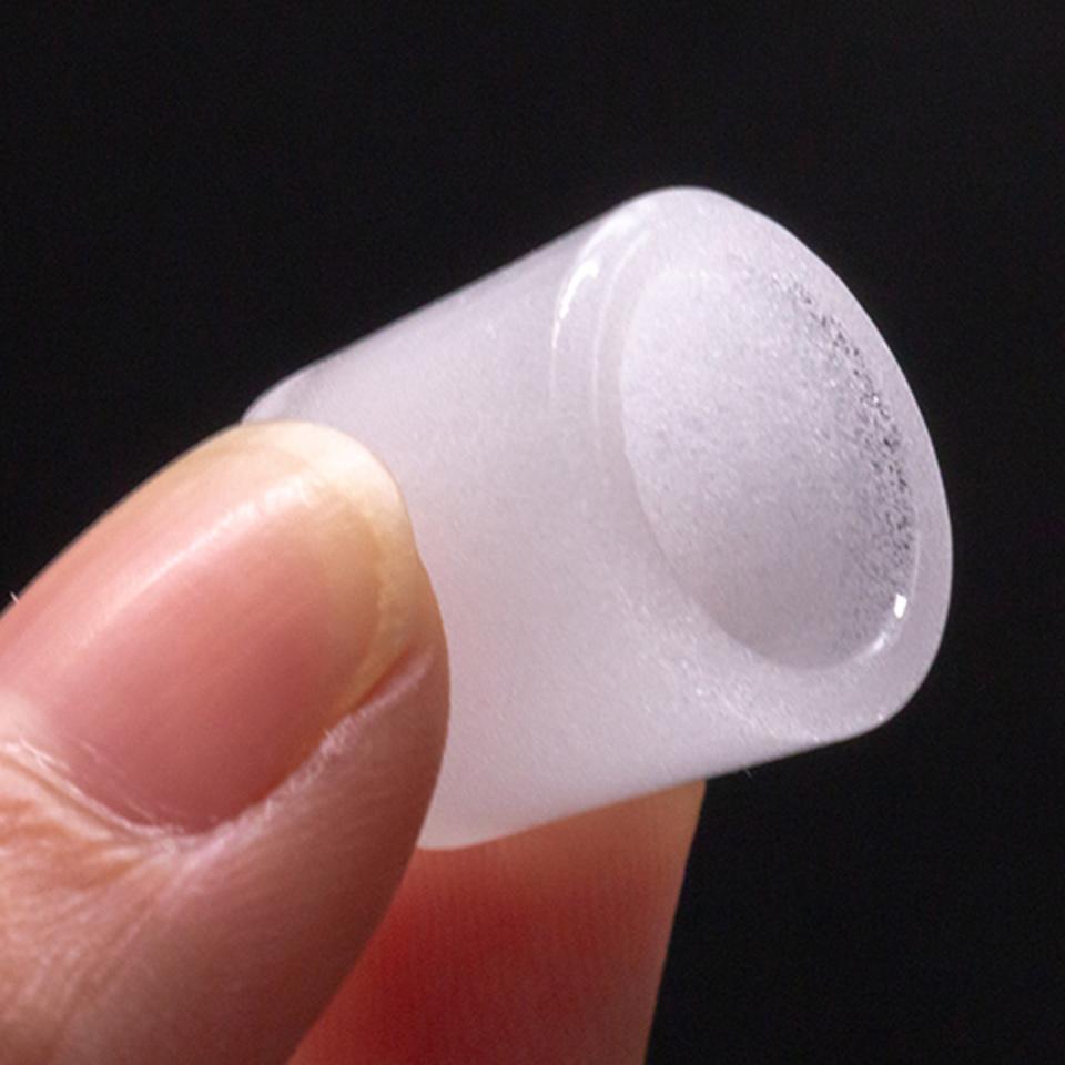 Close-up view of the Puffco Peak Gavel Bowl, showcasing its clear glass construction and rounded shape against a dark background.