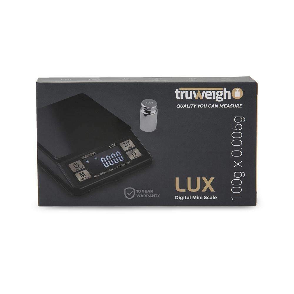 Front view of the Lux Mini Scale 100G X 0.005G, displaying a digital readout on a sleek, black surface.