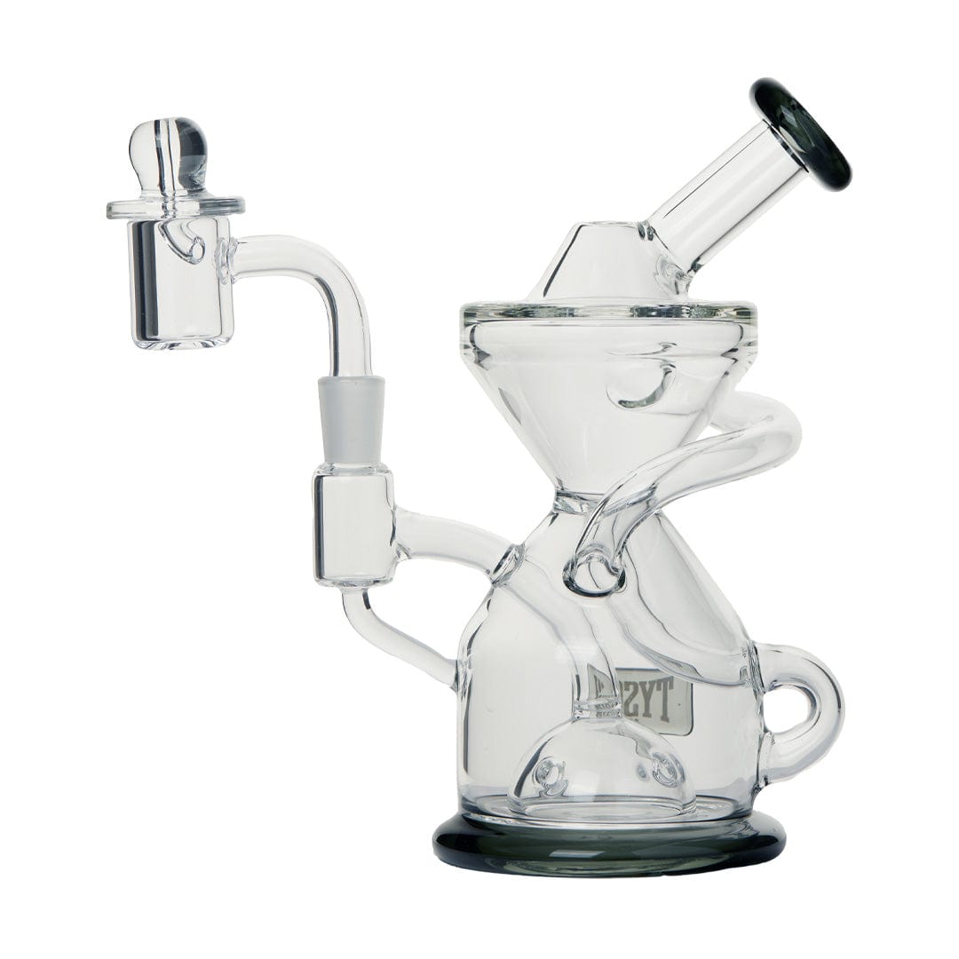 A three-quarter view of the Tyson Knockout Dab Rig, showcasing its clear glass construction and unique angled design.