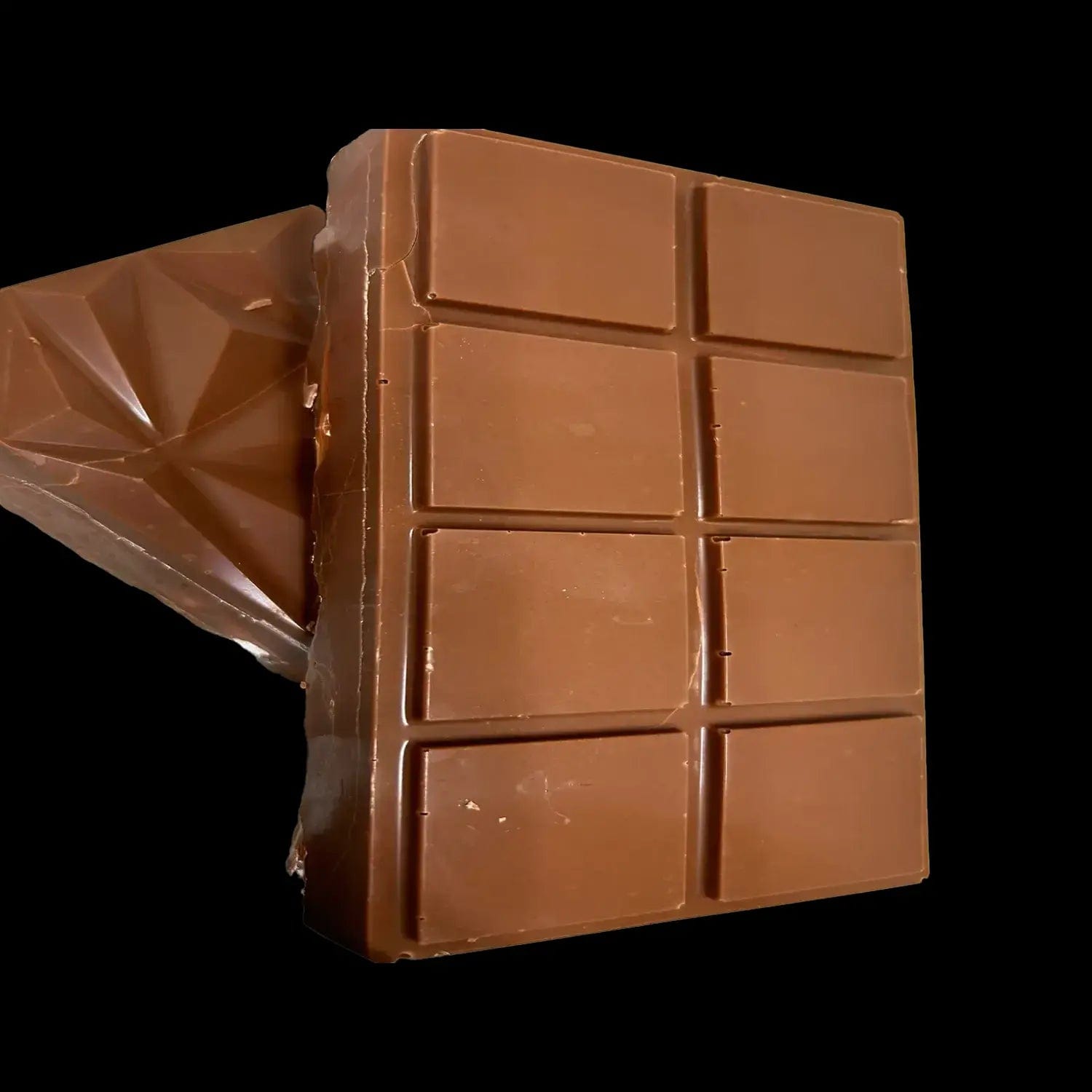 A close-up, angled view of the Upscale Freeze Chocolate Smore, presented in a wrapper with a glossy sheen.