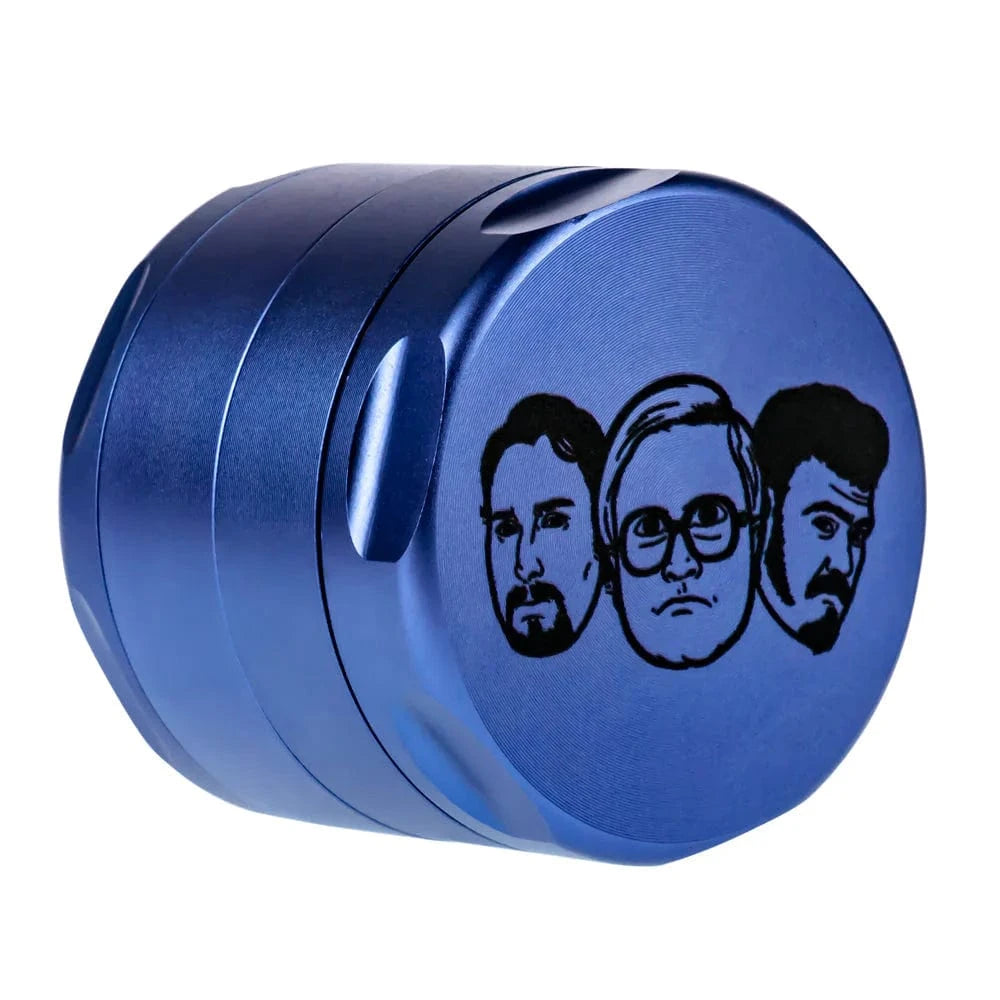 Angled view of a metallic blue Famous X Trailer Park Boys Grinder - Assorted Colors showing three black face illustrations on the lid.
