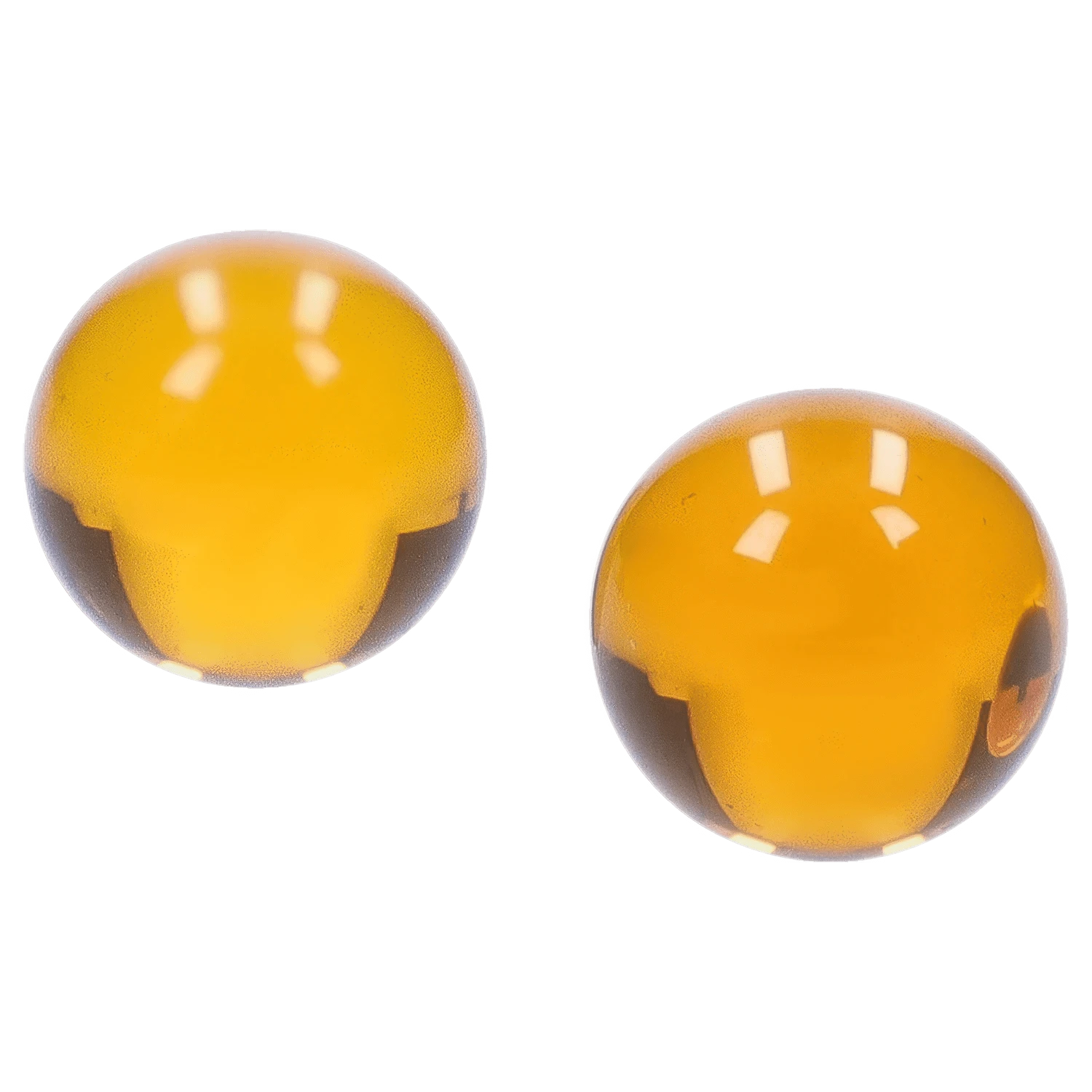 Top-down close-up of two glossy amber spheres from the "Boba and Blaze" Smoking Box reflecting studio lights.