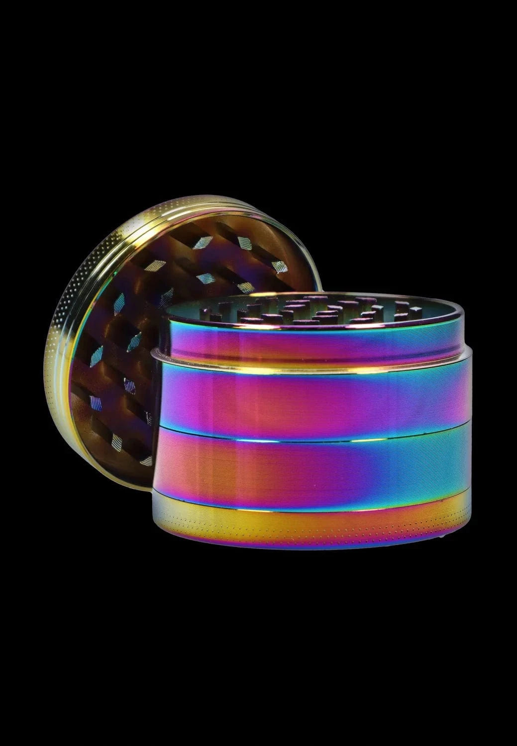 Angled close-up of a rainbow-finish DHC Grooved 3-Stage Grinder - 52mm showing its open, grooved top and stacked cylindrical layers against a black background