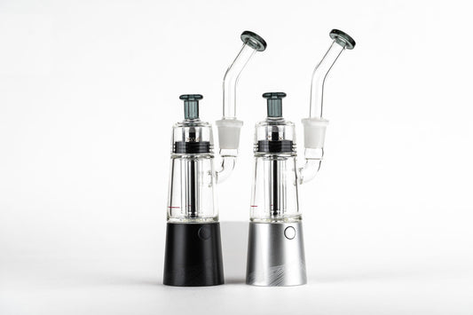 A side-by-side view of two XVAPE VISTA MINI 2 vaporizers, showcasing their silver and black finishes against a plain white background.