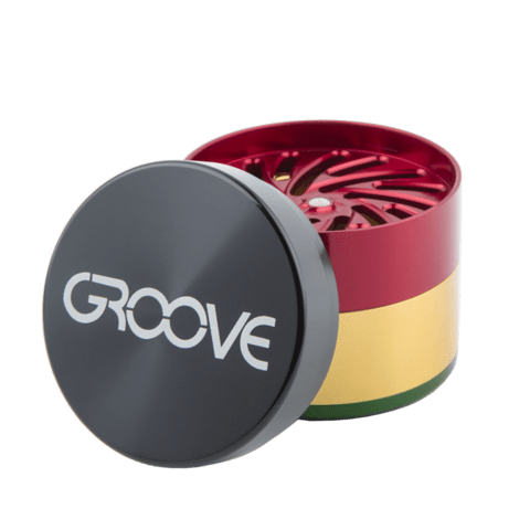 Front view of the Groove 4-Piece Grinder, showcasing its colorful, multi-tiered metal construction with the lid slightly ajar.