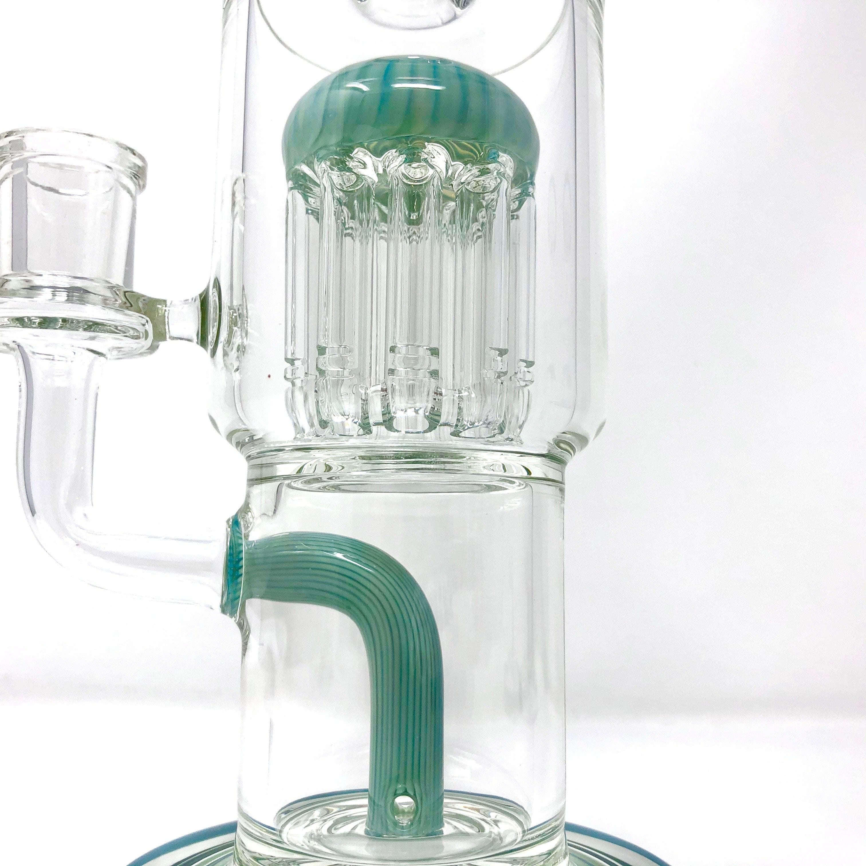 A close-up of the 9" Groovy Tree Arm Perc Dab Rig, showing the clear glass with a unique percolator design against a neutral background.