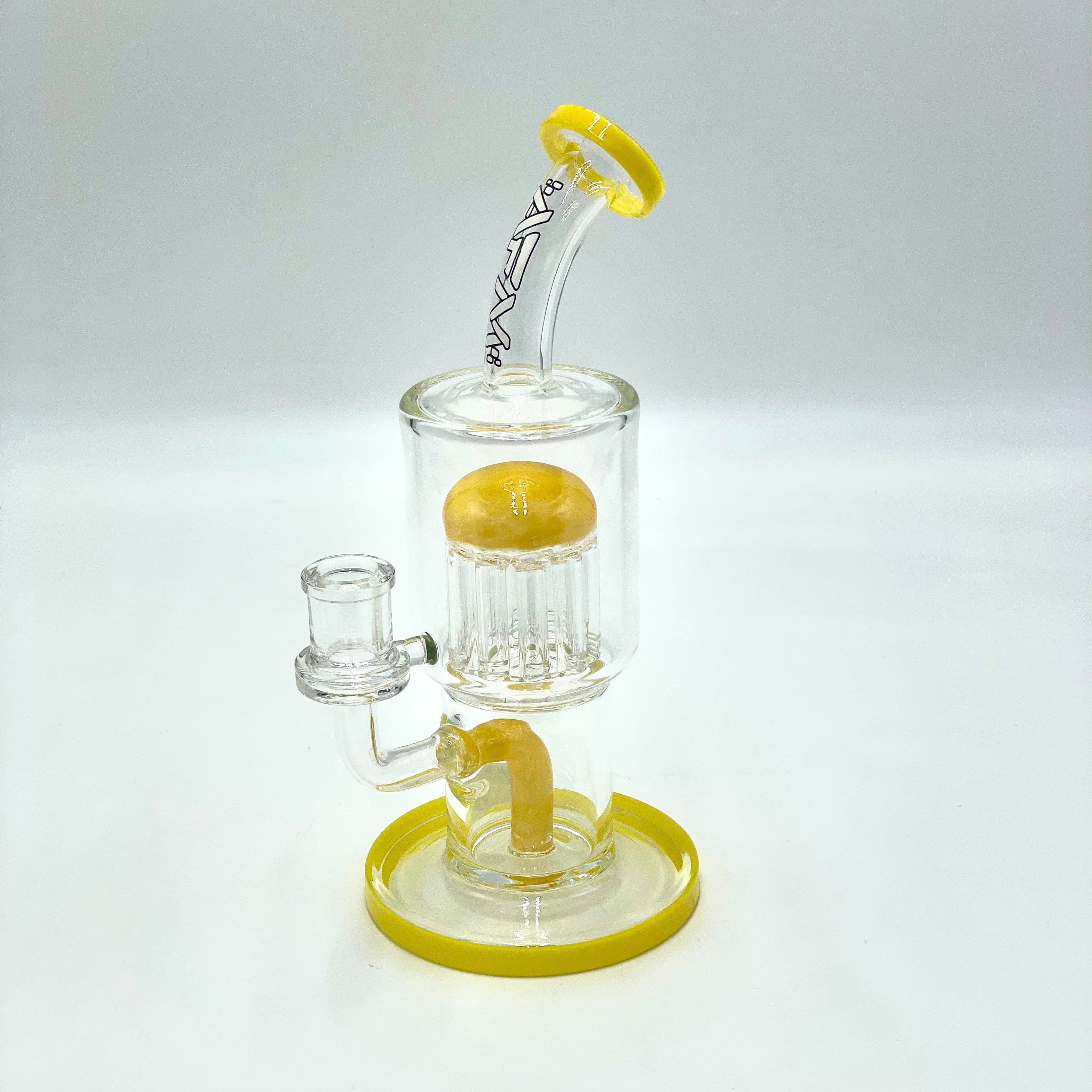 A studio shot of the 9" Groovy Tree Arm Perc Dab Rig, showing a clear glass rig with a textured base against a plain white backdrop.