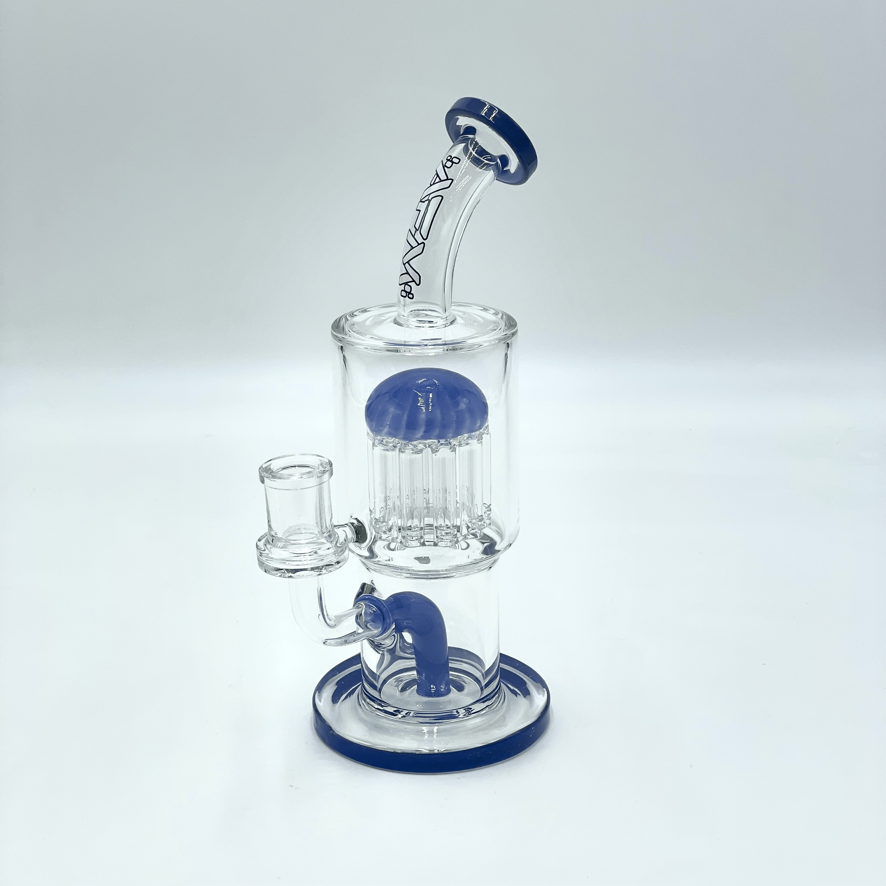 A studio shot of the 9" Groovy Tree Arm Perc Dab Rig, featuring a clear glass construction and unique percolator visible from a slightly elevated angle.