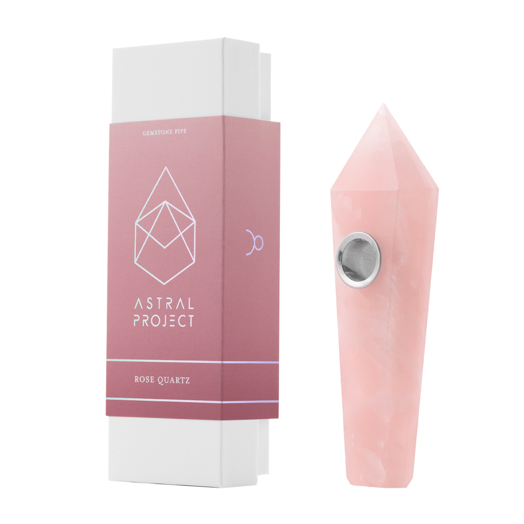 Front view of the Gemstone Pipe, a polished rose-colored stone pipe angled against a plain white background.