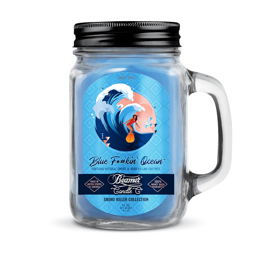 Front view of the Smoke Killer 12oz Candles in a blue and white label, featuring a stylized wave design.