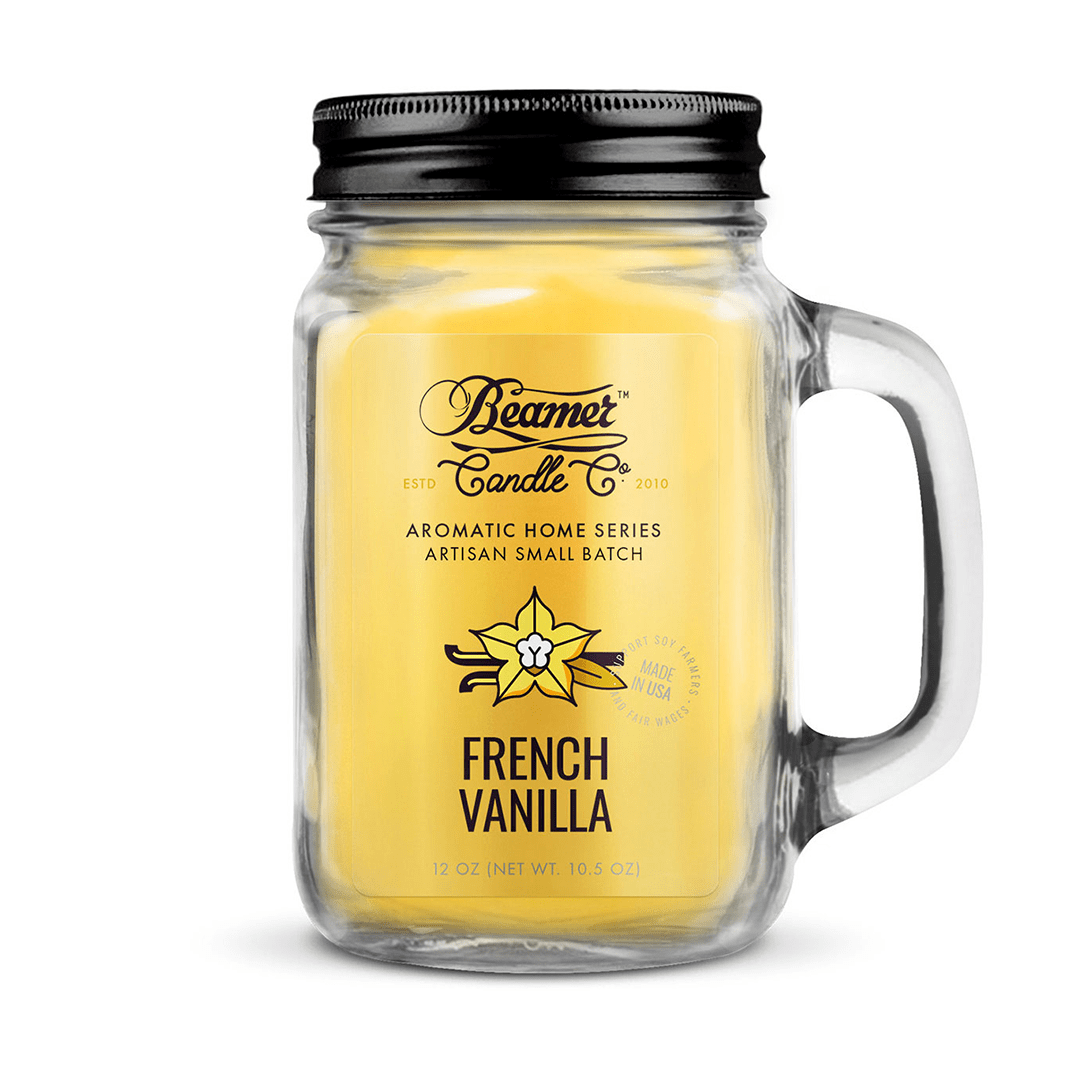 A close-up, angled view of the 12oz Smoke Killer Candles in a clear glass jar, showing the wax and label details.