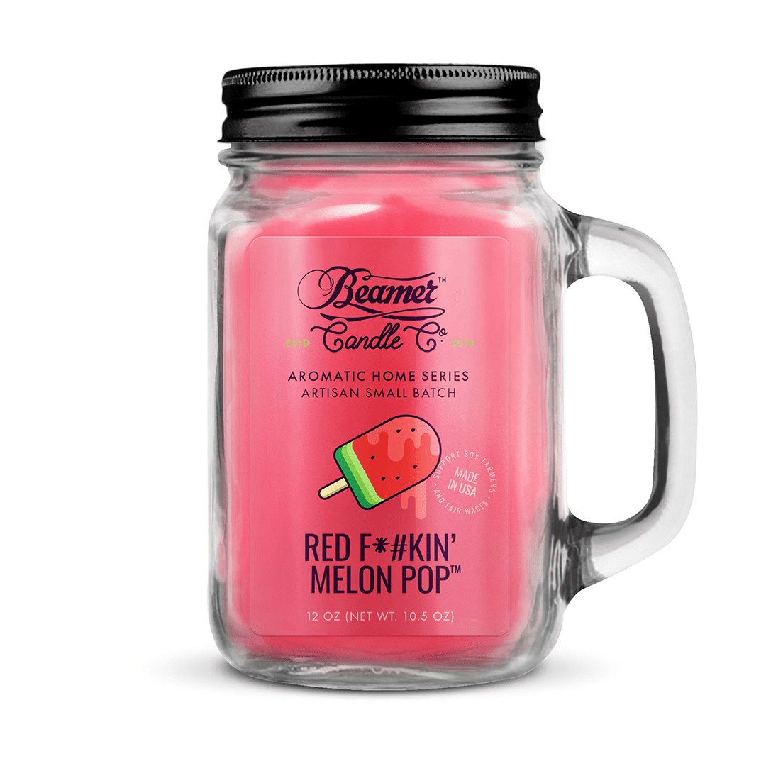 Front view of the Smoke Killer 12oz Candles in a clear jar with a label featuring a colorful design.