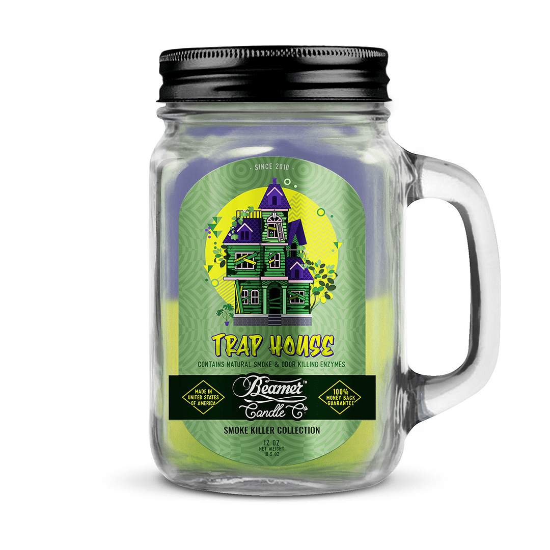 A front view of the Smoke Killer 12oz Candles with a whimsical house illustration on a dark label.