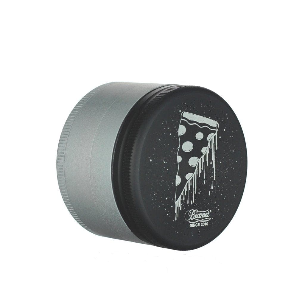 A close-up, angled view of the Beamer Aircraft Grade Aluminum Grinder, showcasing its metallic finish and cylindrical shape.