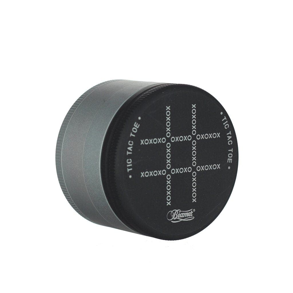 A close-up, angled view of the Beamer Aircraft Grade Aluminum Grinder, showcasing its metallic texture and circular design.