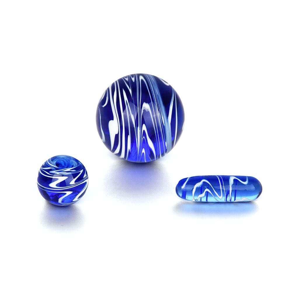 A close-up, angled view of the Pillar Set - Blue, displaying its smooth, swirling blue glass construction.