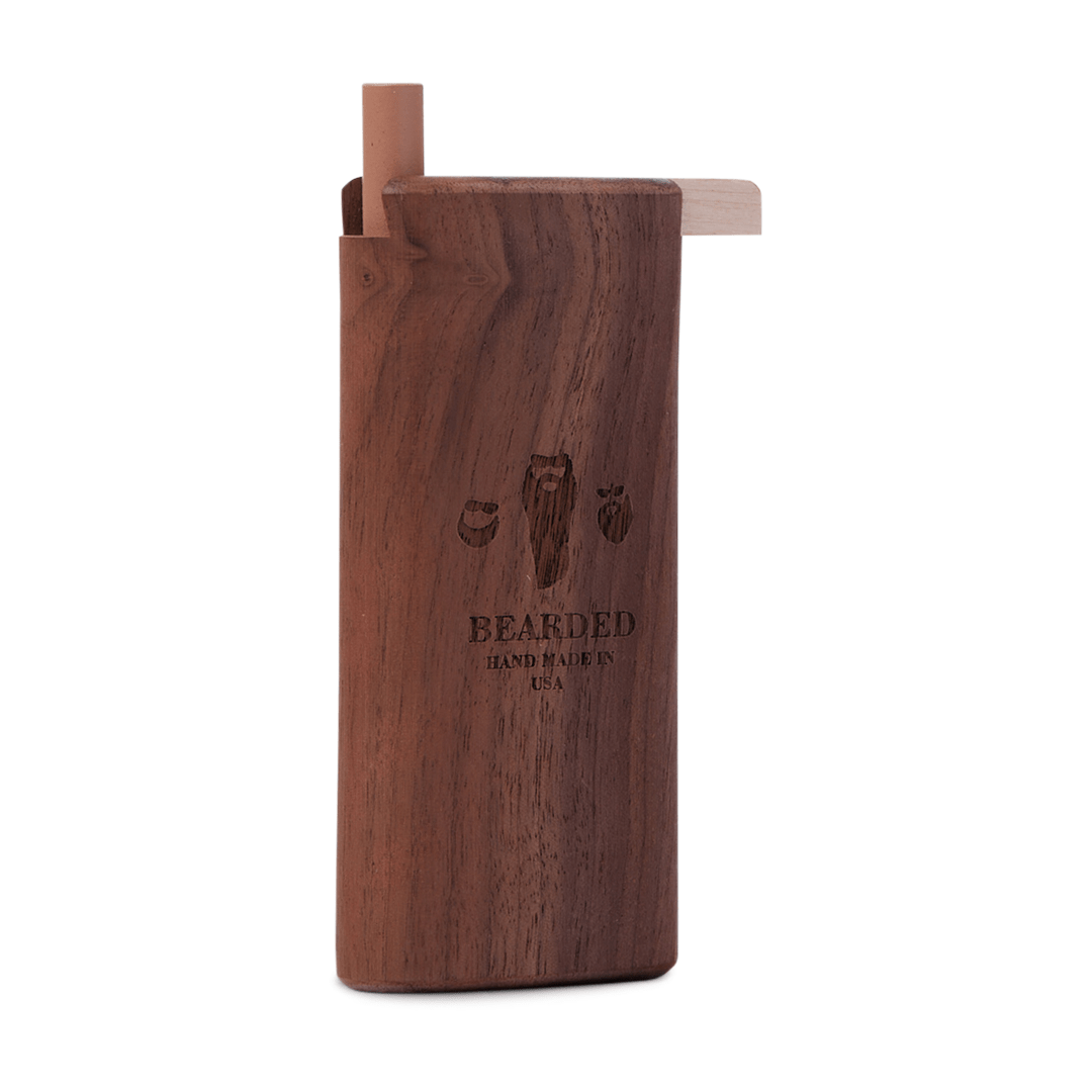 A close-up, angled view of the Bearded Slide-Top Dugout, showing its dark wood grain and simple, rectangular form.