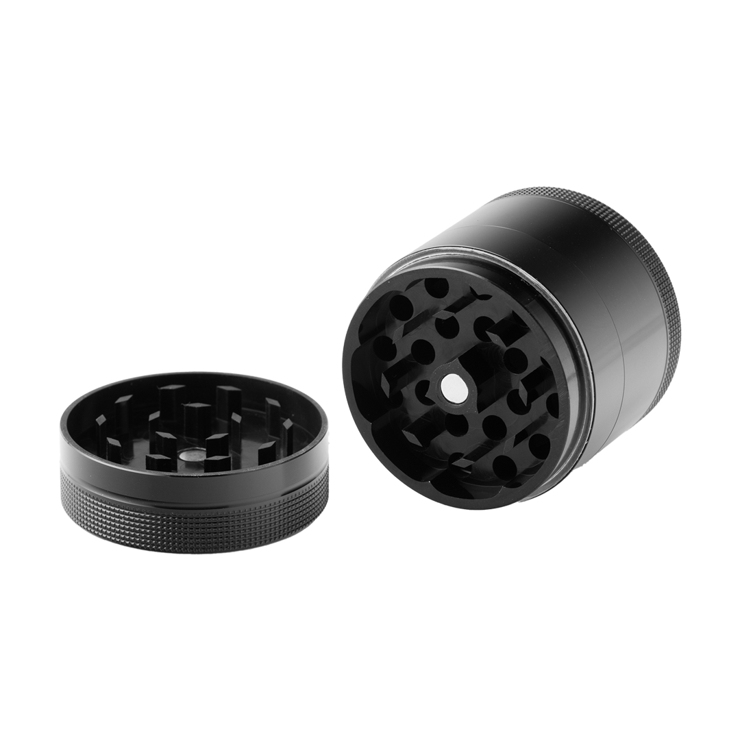 A top-down view of the open BIGFUN! Small Grinders, revealing the internal grinding teeth within the metallic cylinder.