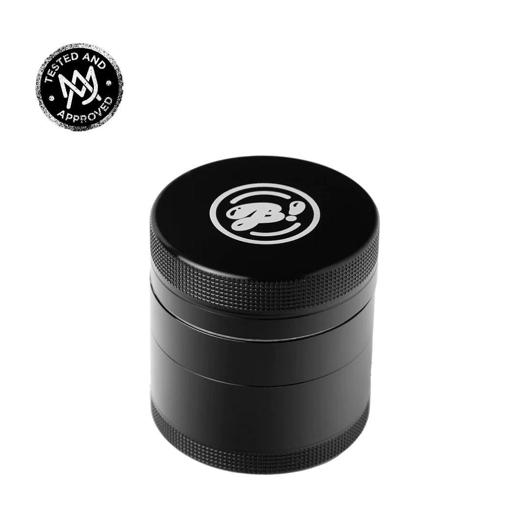 A close-up, angled view of the BIGFUN! Small Grinders, showcasing its metallic, cylindrical shape against a neutral background.