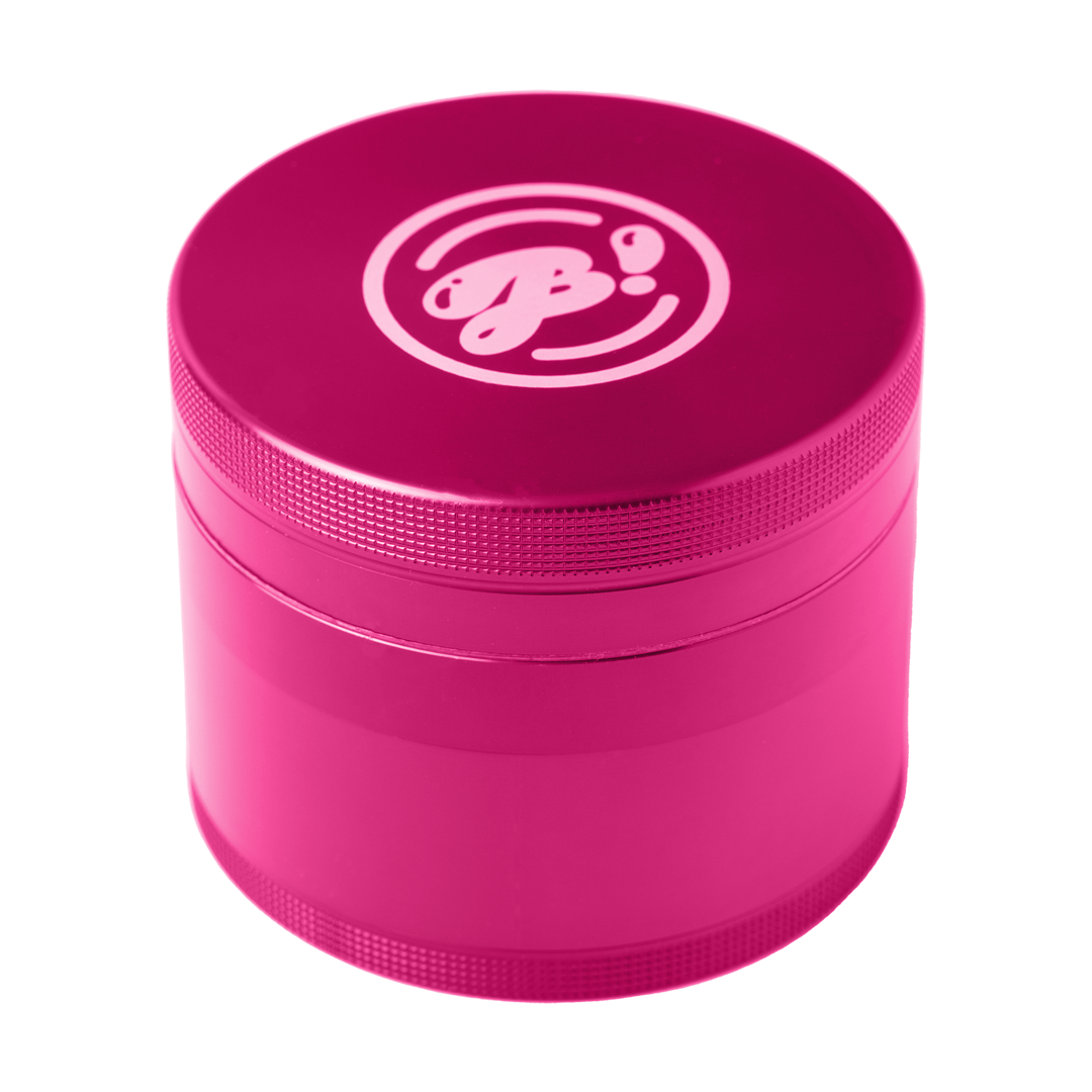 A close-up, angled view of the BIGFUN! XL Grinders, showcasing its metallic pink finish and cylindrical shape.