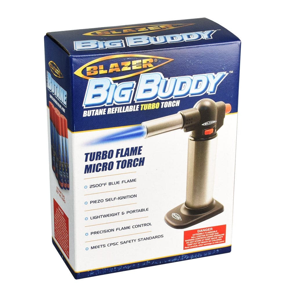 A close-up, angled view of the Blazer Big Buddy Torch Lighter with its label and silver-toned body details clearly visible.