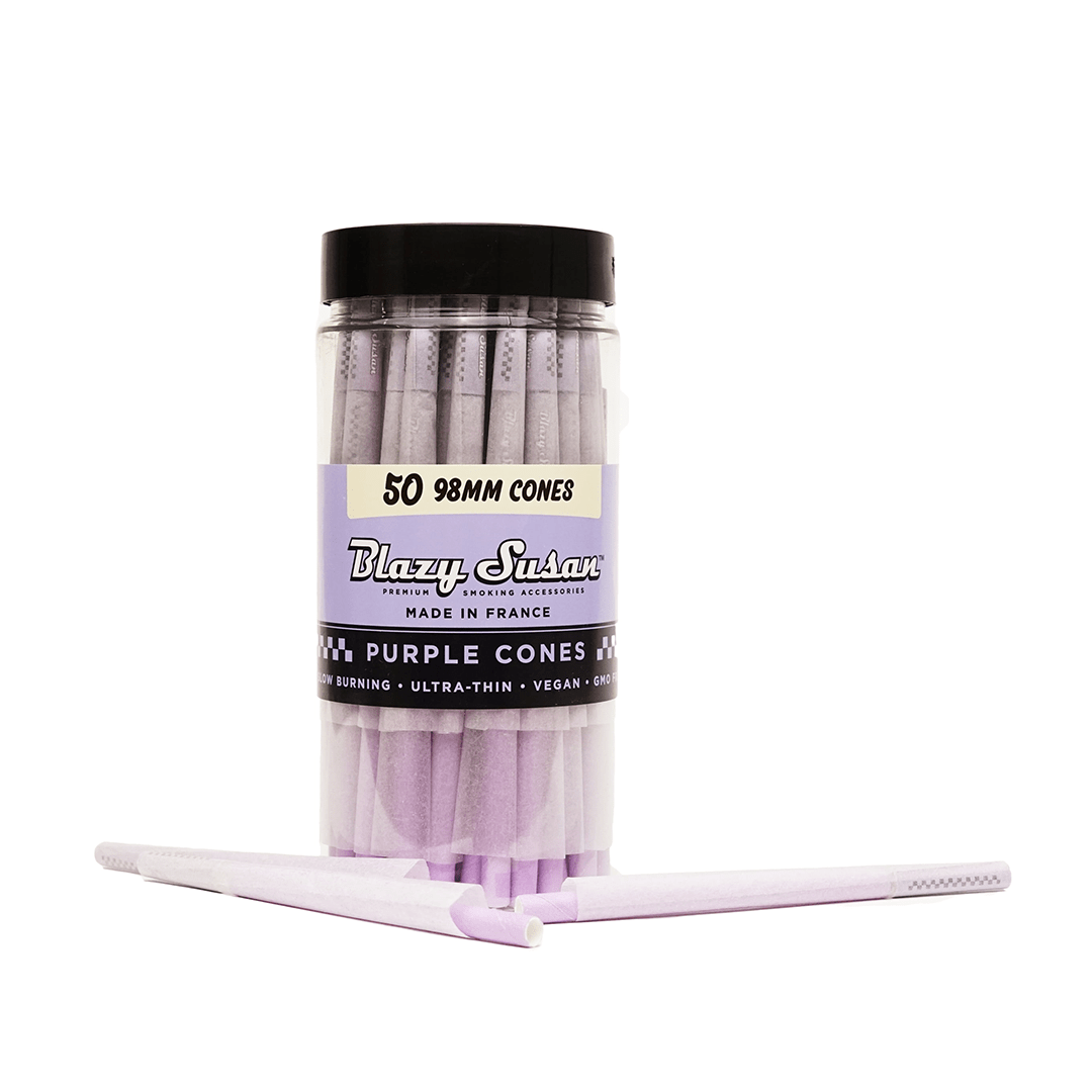 A stack of Blazy Susan Purple Paper Cones, presented against a plain black background in a clear, close-up shot.