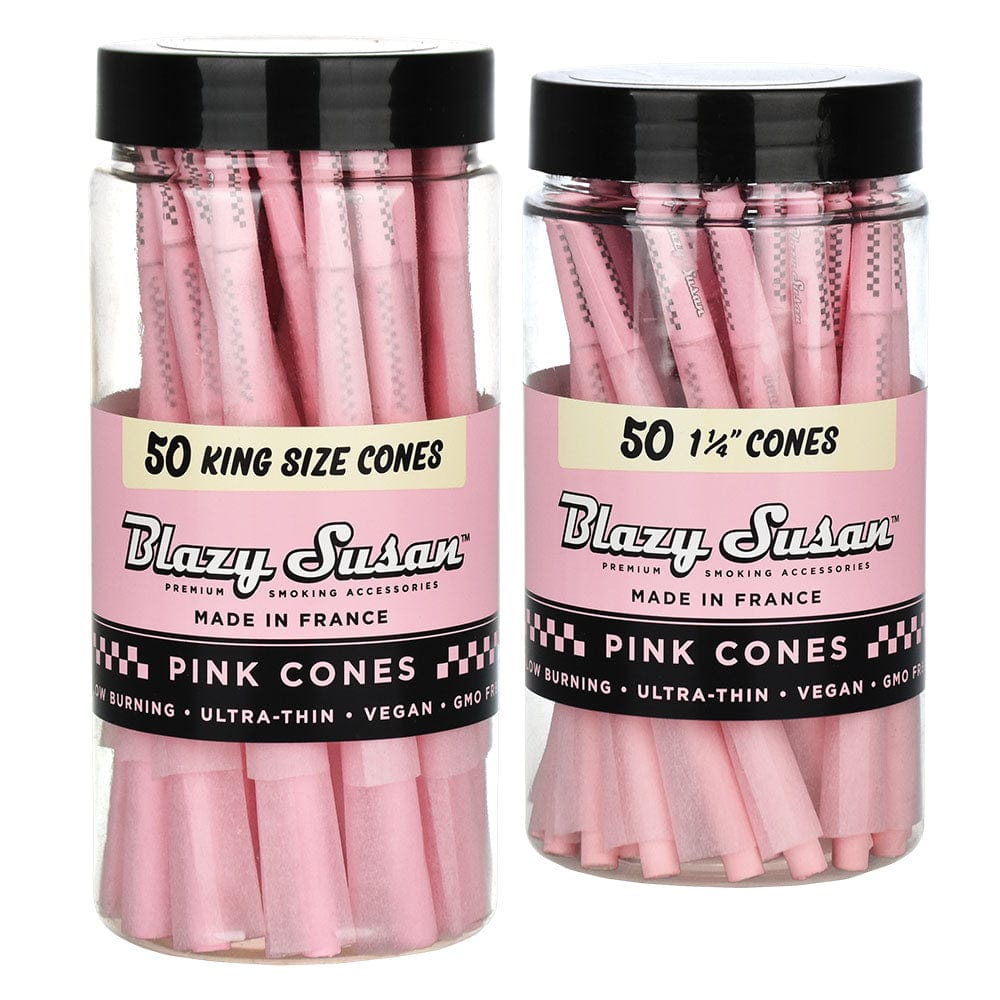 A stack of pink Blazy Susan Pre-Rolled Cones 50 Pack, shown from a slight angle against a dark background.