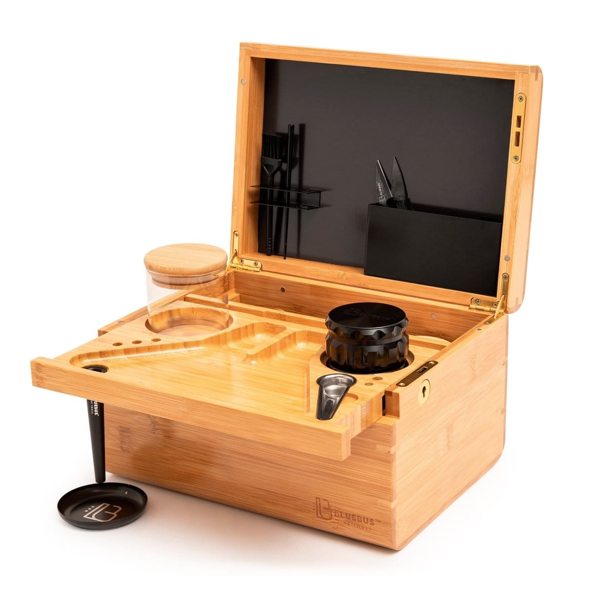 A top-down view of the open Blue Bus DISCOVERY Storage Box displaying several items inside its wooden interior.