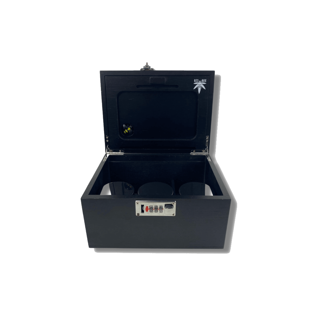 A top-down view of the open Large Black Bamboo Bzz Box, revealing its segmented interior and dark wood grain.