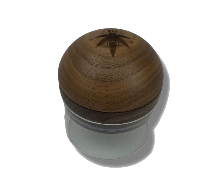 Overhead view of The Bzz Glass Grinder, showcasing its metallic, multi-tiered construction against a plain white backdrop.