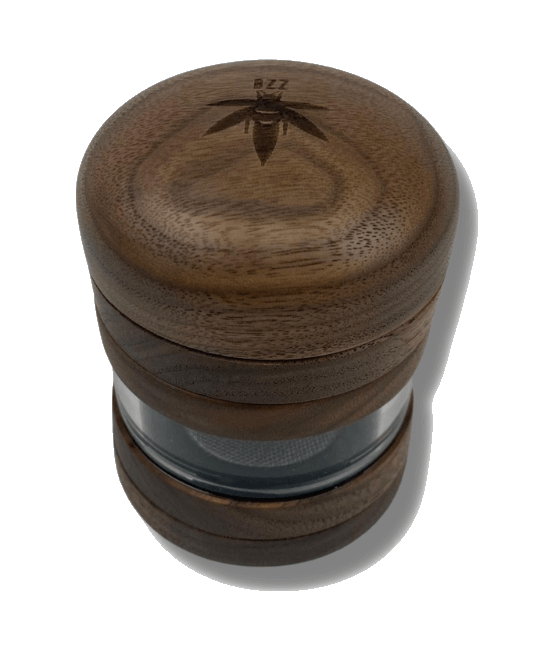 A close-up, angled view of The Bzz 4 Piece Grinder, showcasing its multi-tiered, cylindrical design.