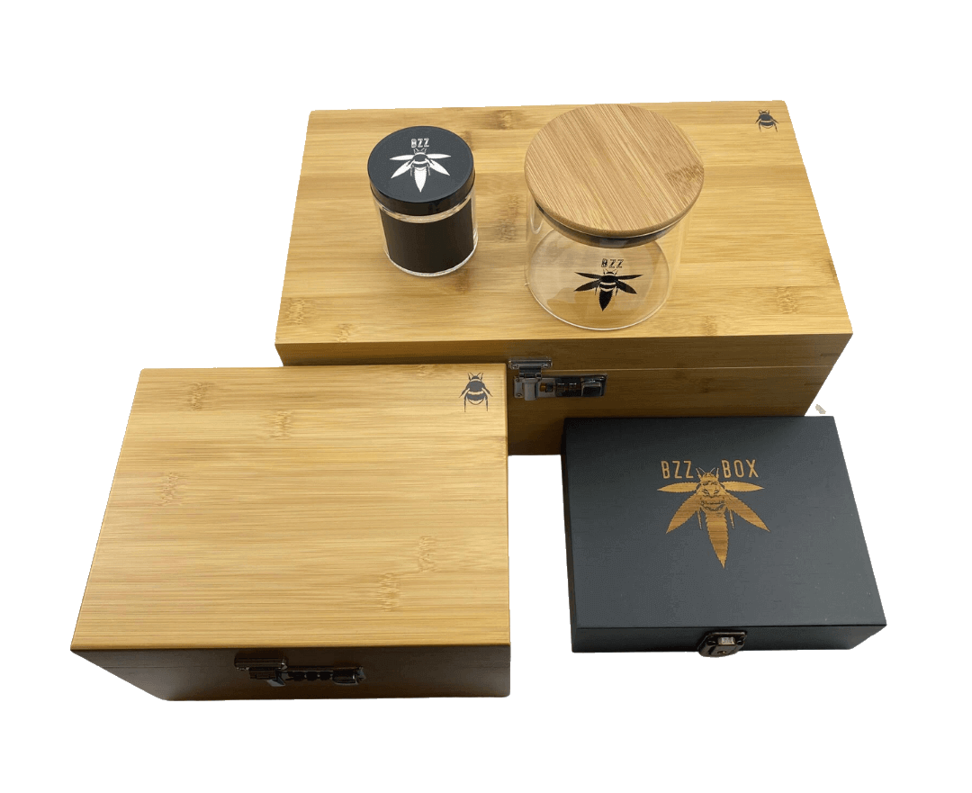 Front view of The Bzz Box Stash Box Collection, showcasing three nested, dark wooden boxes in XL, large, and small sizes.