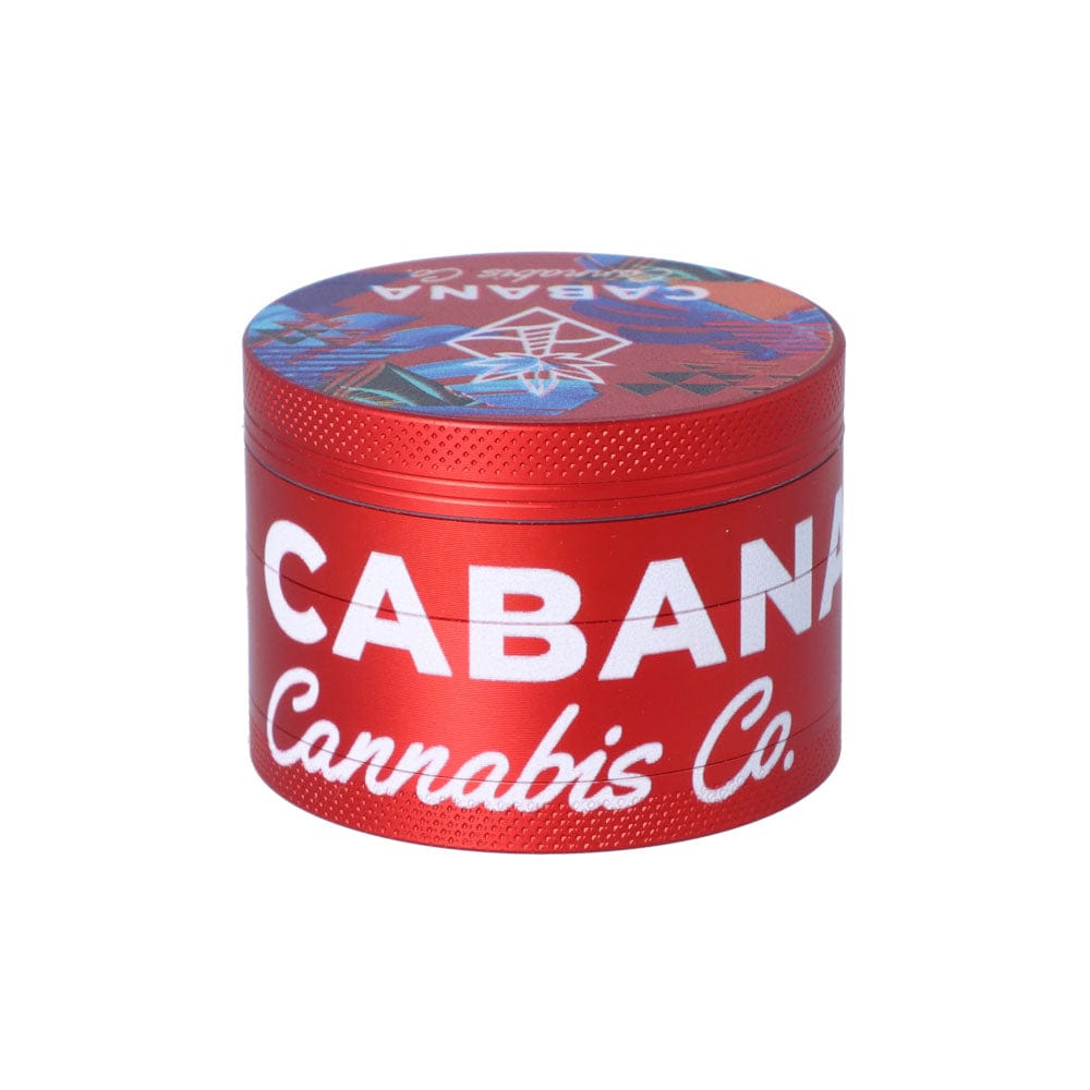 A close-up, angled view of The Dawn 55mm 3-Stage Herb Grinder, featuring a metallic finish and textured design.