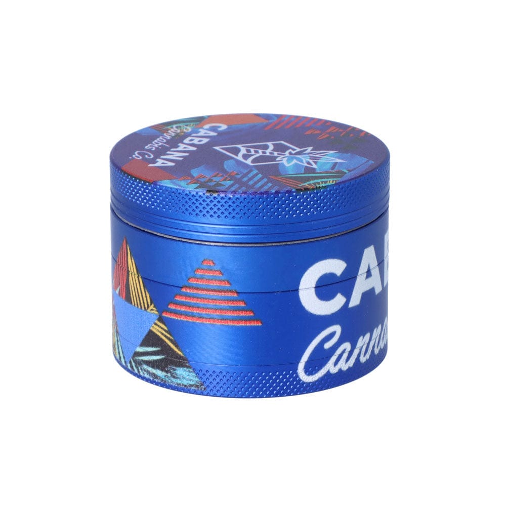 Front view of The Dawn 55mm 3-Stage Herb Grinder, a metallic grinder with a detailed circular design on its top surface.