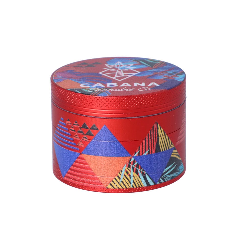 Front view of The Dawn 55mm 3-Stage Herb Grinder, featuring a colorful, geometric pattern on a metal surface.