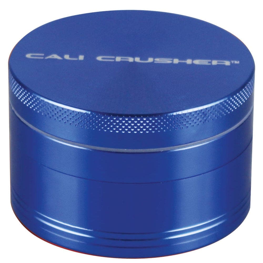 A close-up, front view of the silver Cali Crusher O.G Grinder, showcasing its circular, multi-part design.