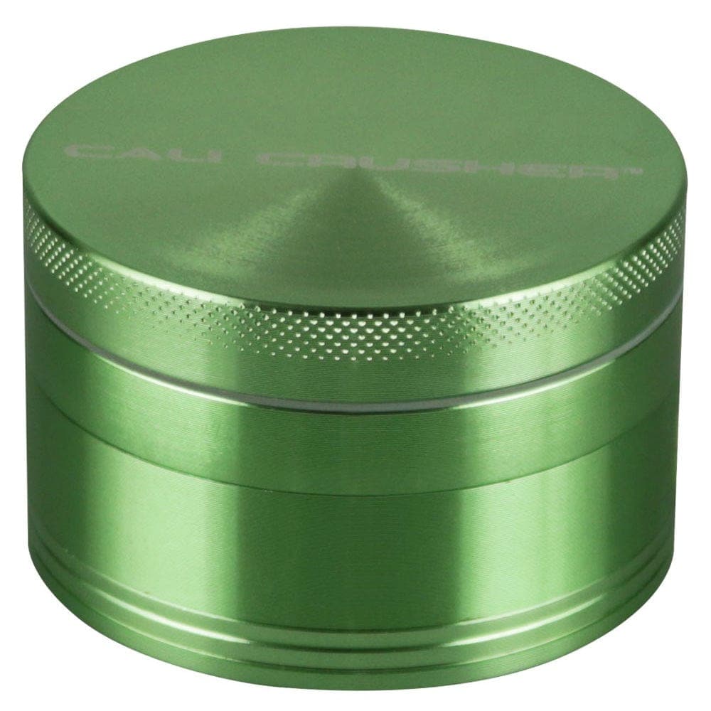 Front view of the Cali Crusher O.G. Grinder, a silver, four-piece, 2-inch grinder with a textured surface and circular design.