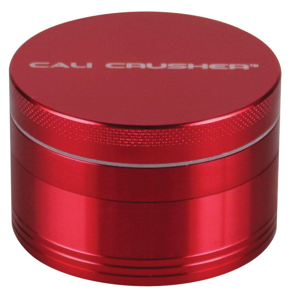 A front view of the Cali Crusher O.G. Grinder, a metallic, four-piece grinder with a cylindrical shape.