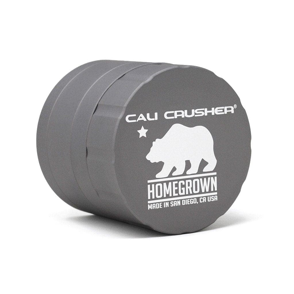 Front view of the Cali Crusher Homegrown Grinder 4pc, showcasing its metallic finish and compact, multi-piece design.
