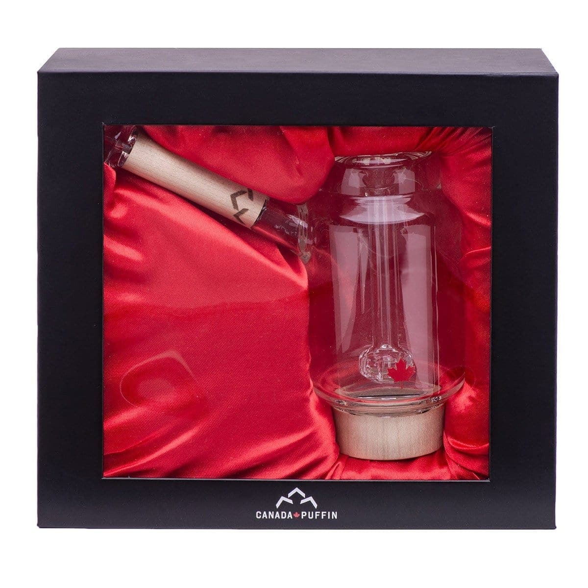 Front view of the Canada Puffin Arctic Bubbler, a clear glass piece with a rounded base set against a dark red backdrop.