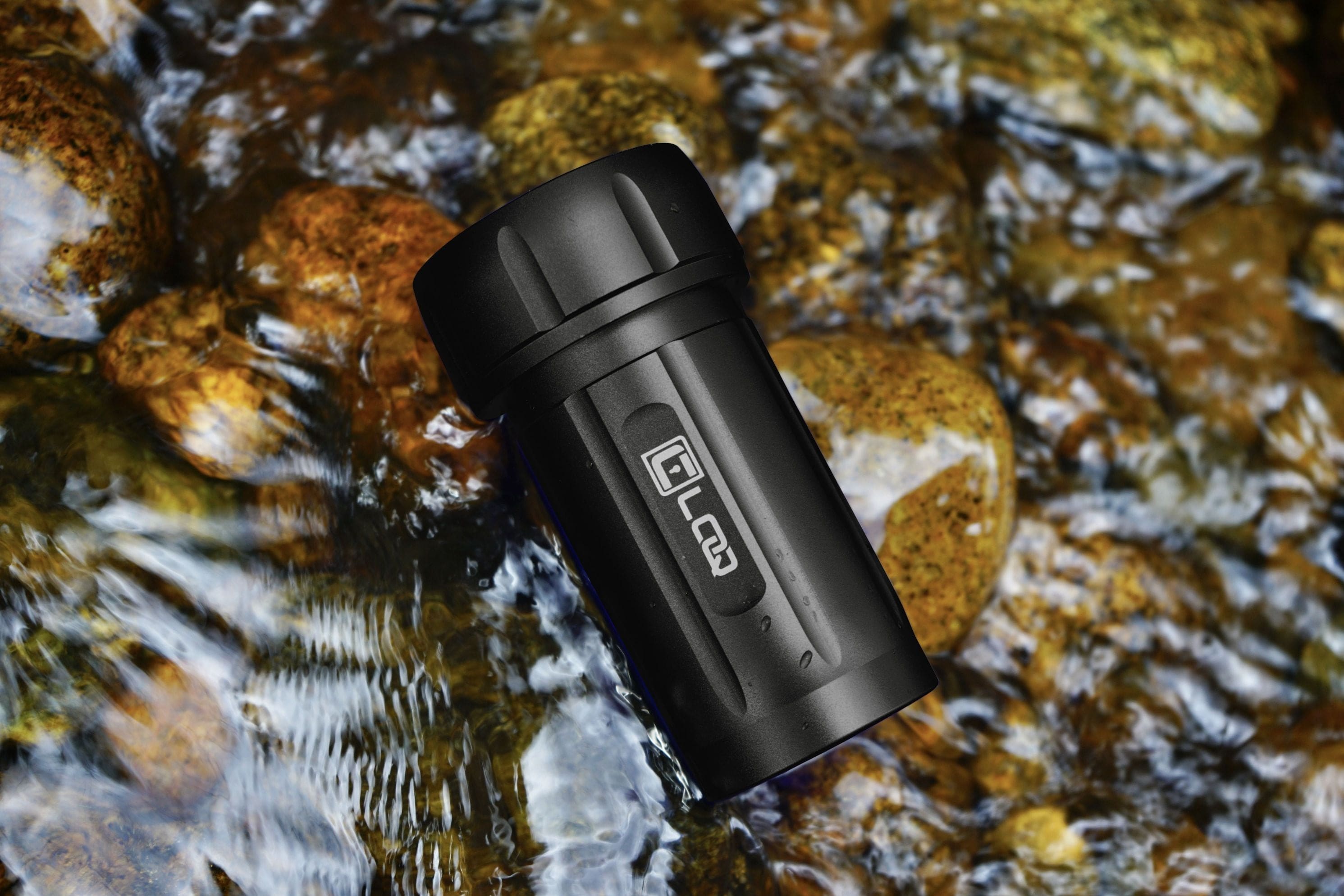 A close-up shot of the Zytel Black Premium 120CC Storage Canister with a tan cap against a blurred, watery background.