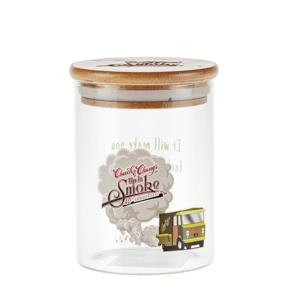 Front view of the Up In Smoke 40th Anniversary Big Green Van Stash Jar, a clear glass jar decorated with a vintage van design.