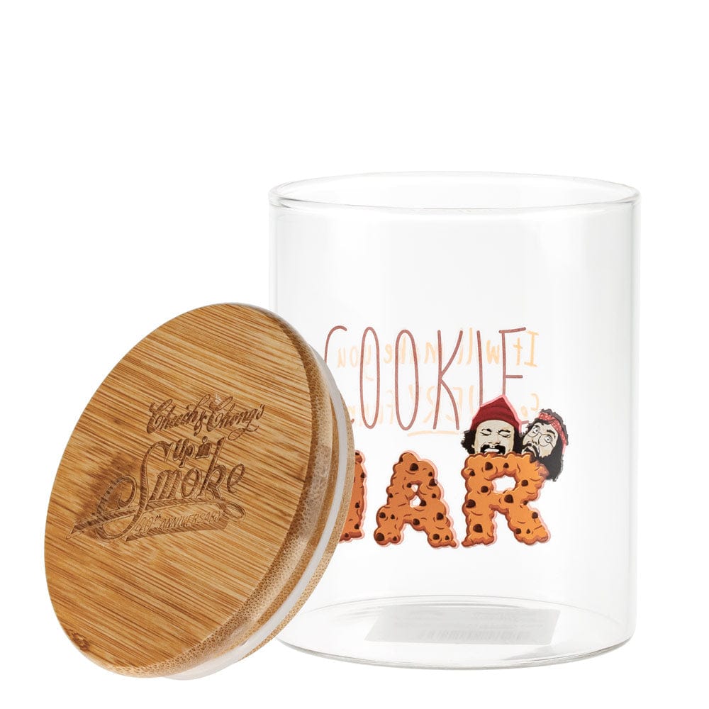 A slightly angled view of the open “Up In Smoke 40th Anniversary Cookie Stash Jar”, revealing its empty interior and wooden lid.