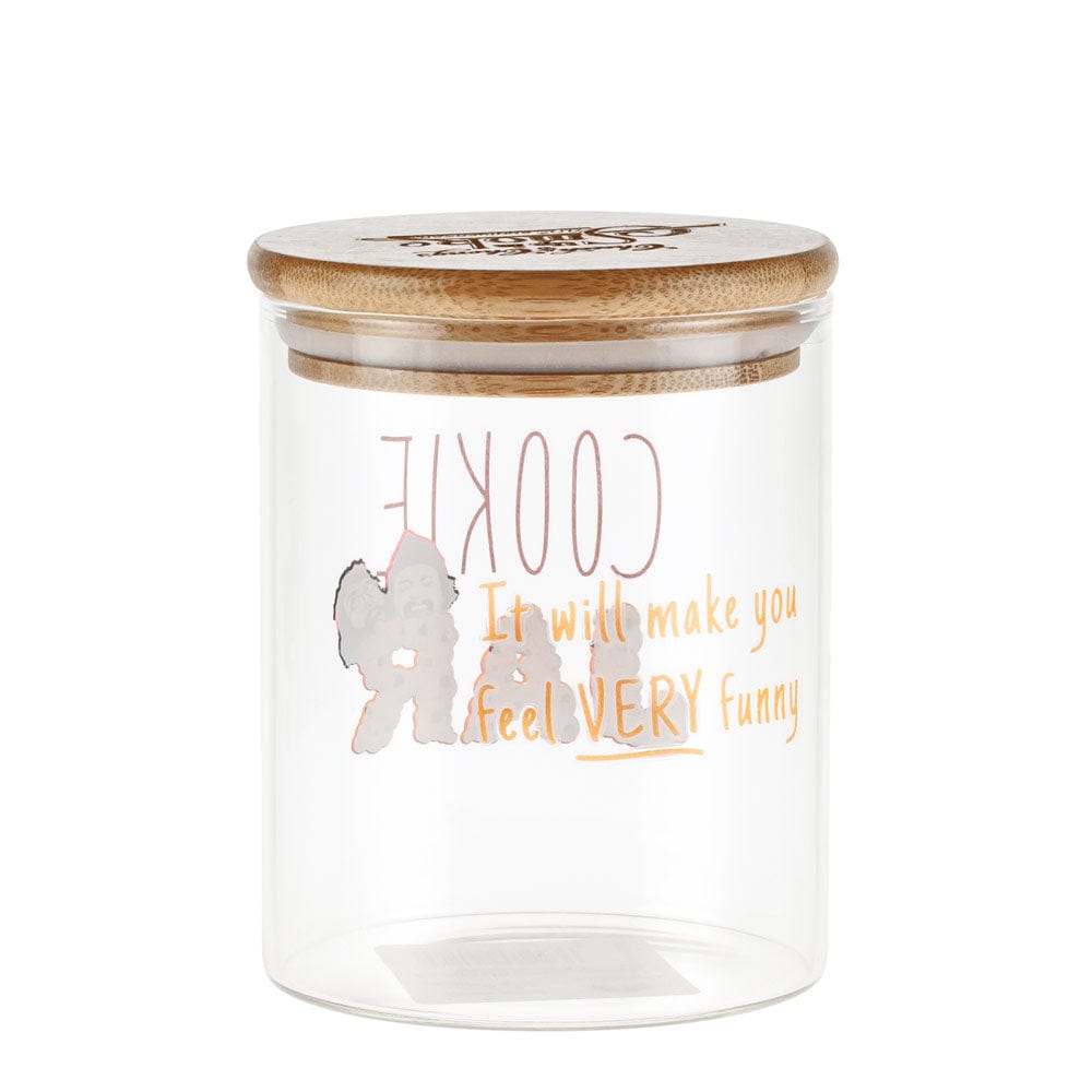A slightly angled view of the Up In Smoke 40th Anniversary Cookie Stash Jar, featuring a clear glass container with a wooden lid.
