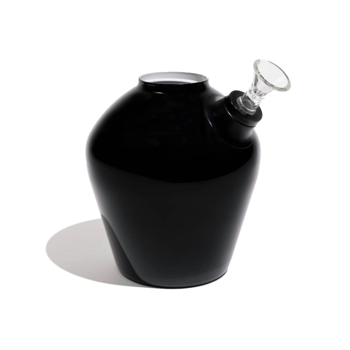 A low-angle shot of the Chill Steel Pipes Mix & Match Series Base, featuring a dark, rounded shape and subtle shadow on a neutral background.