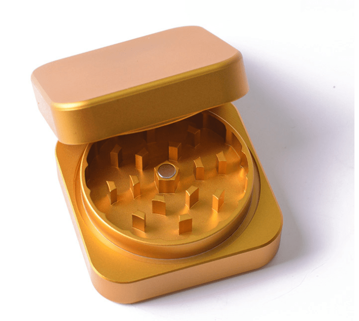 A top-down view of the 2 Piece Aluminum Square Grinder, displaying its open, multi-tiered interior and square shape.