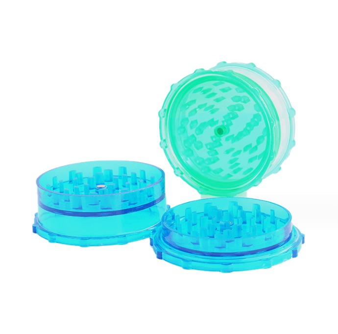 A top-down view of the “3” Large Plastic Grip Edge Grinder, showcasing its circular design and textured grip edge.